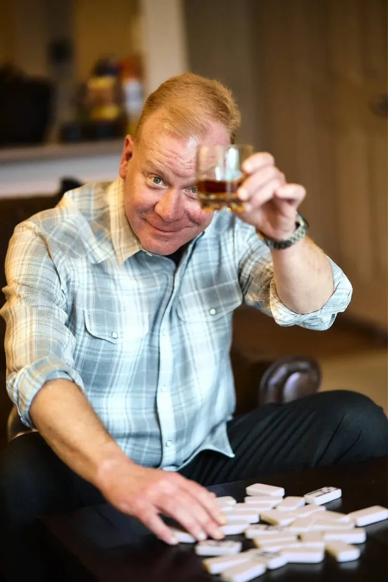 Man laughing during a coached dating profile photo session in Austin
