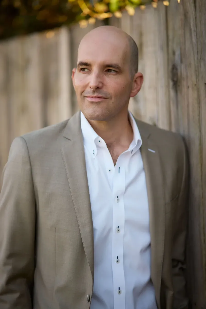 Man smiling on location during an Austin dating profile photo shoot